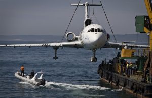 The jetliner of former Bulgarian dictator Todor Zhivkov is prepared to be submerged and turned into an underwater tourist attraction off the country's Black Sea coast in Varna on May 25, 2011. The body of the Tupolev 154 will become an artificial reef aimed at attracting scuba divers. The plane, built in 1971, was stripped of its cables and engines before being sunk at a depth of about 70 feet. 